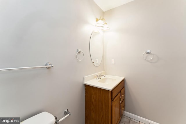 15533 Pamplin Pipe Ct, Manassas, VA 20112 - bathroom with tile patterned flooring, toilet, vanity, and baseboards