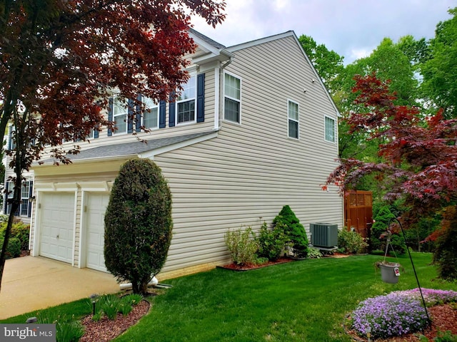 15533 Pamplin Pipe Ct, Manassas, VA 20112 - view of property exterior featuring a garage and a lawn