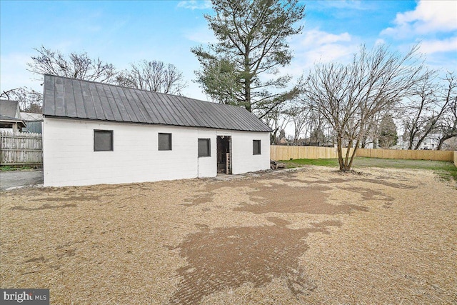 view of outbuilding with fence
