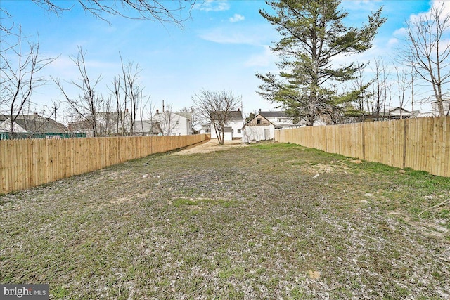 view of yard with a fenced backyard