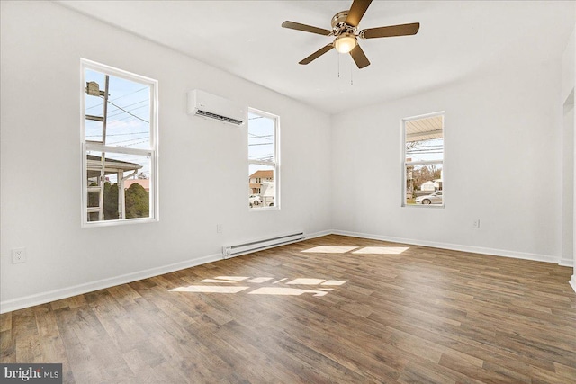 unfurnished room with wood finished floors, baseboards, a wall mounted air conditioner, ceiling fan, and baseboard heating