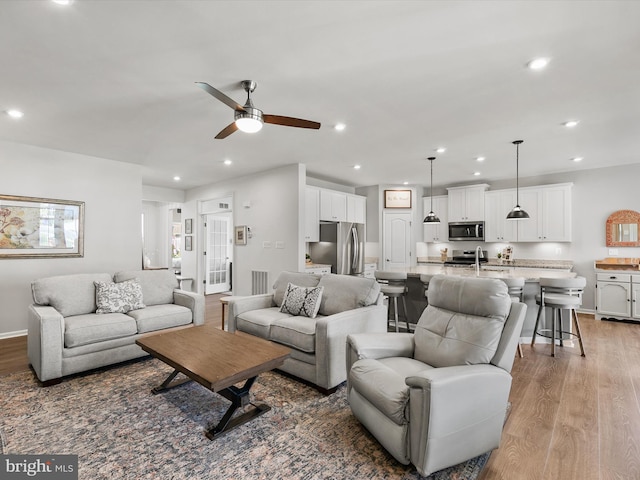 20515 Anchor Ln, Frankford, DE 19945 - living area featuring light wood-style floors, a ceiling fan, baseboards, recessed lighting, and visible vents