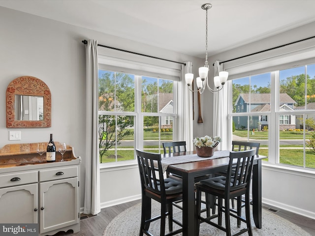 20515 Anchor Ln, Frankford, DE 19945 - dining room featuring baseboards, visible vents, dark wood-style floors, and a notable chandelier