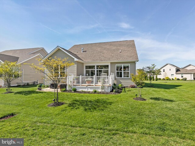 20515 Anchor Ln, Frankford, DE 19945 - rear view of house with a lawn, a wooden deck, and a shingled roof