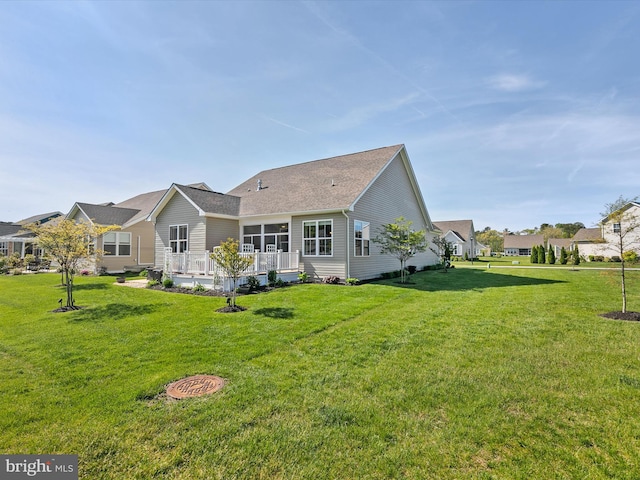 20515 Anchor Ln, Frankford, DE 19945 - rear view of house with a lawn and a wooden deck