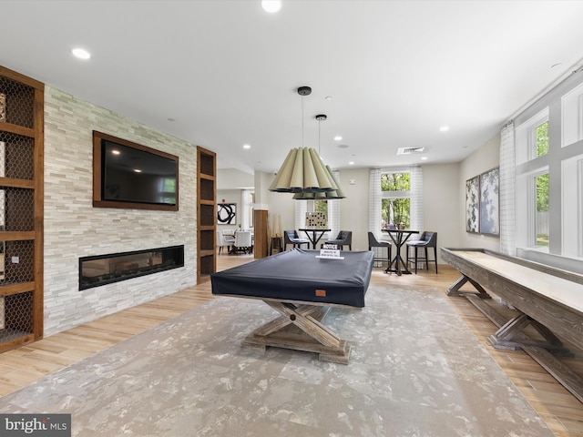 20515 Anchor Ln, Frankford, DE 19945 - recreation room with recessed lighting, a large fireplace, and wood finished floors