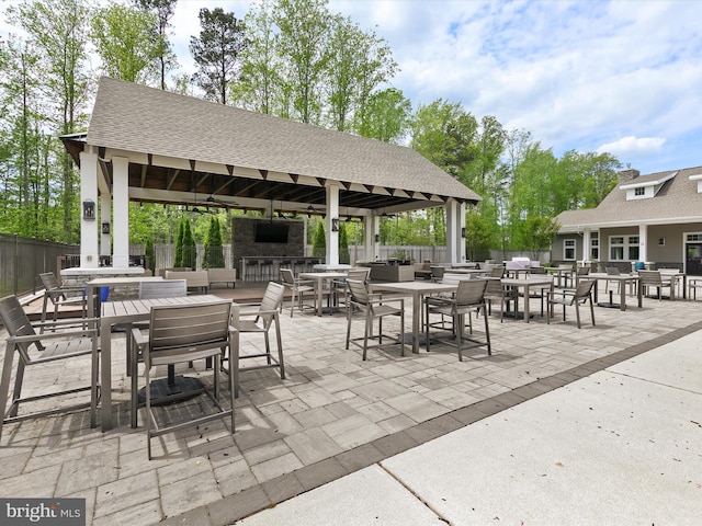 20515 Anchor Ln, Frankford, DE 19945 - view of patio with exterior kitchen, a gazebo, fence, and outdoor dining space