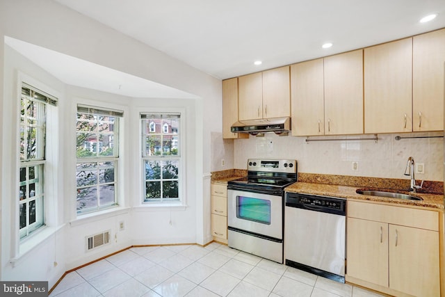 9239 Sand Creek Ct, Burke, VA 22015 - kitchen with visible vents, light stone countertops, under cabinet range hood, a sink, and appliances with stainless steel finishes