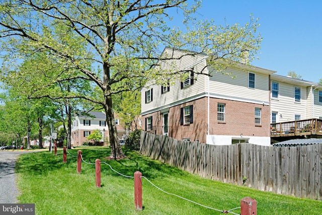 9239 Sand Creek Ct, Burke, VA 22015 - view of property exterior featuring fence, a chimney, and a lawn
