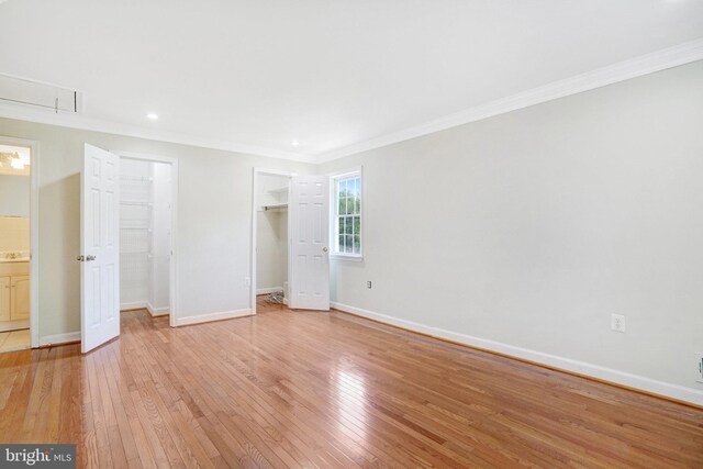 9239 Sand Creek Ct, Burke, VA 22015 - unfurnished bedroom featuring crown molding, baseboards, attic access, and light wood-style floors