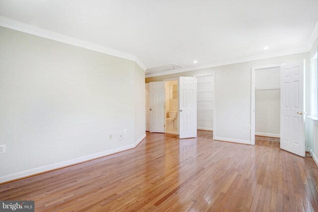 9239 Sand Creek Ct, Burke, VA 22015 - interior space featuring attic access, crown molding, light wood-type flooring, baseboards, and a spacious closet
