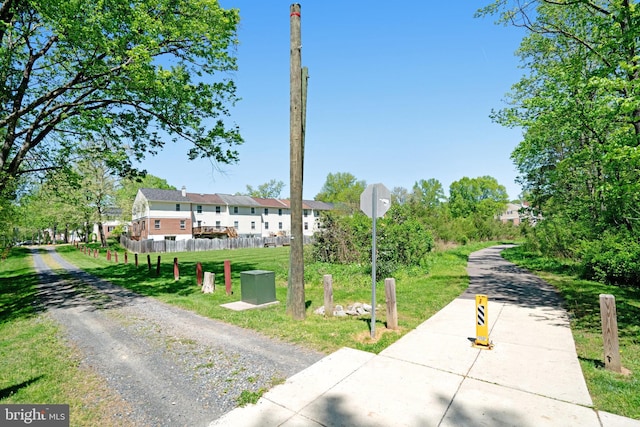 view of home's community with a lawn