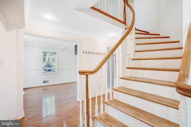 9239 Sand Creek Ct, Burke, VA 22015 - staircase with visible vents, ornamental molding, baseboards, and wood finished floors