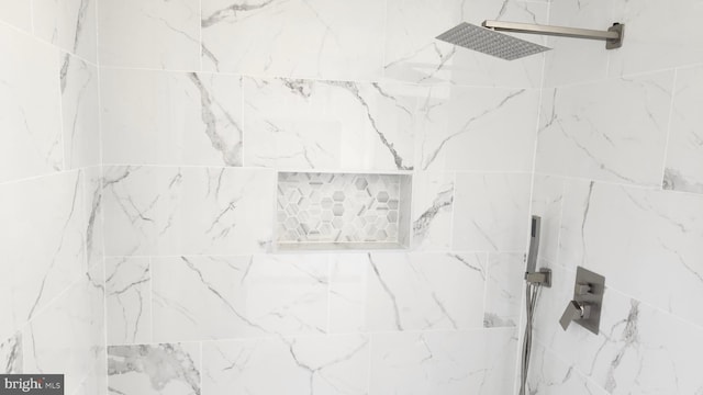 full bathroom with tiled shower