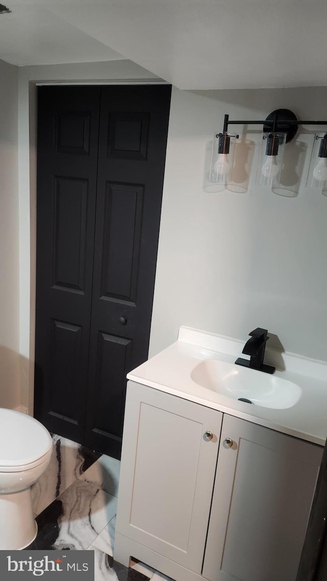 bathroom with vanity and toilet