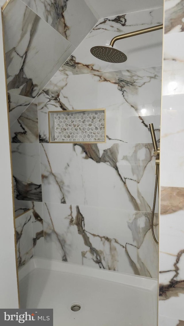 room details with a marble finish shower