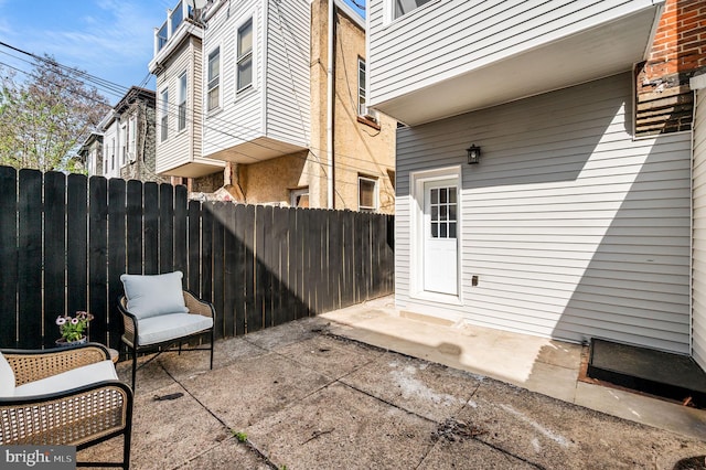 view of patio featuring fence