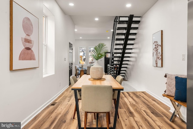 dining area featuring baseboards, recessed lighting, wood finished floors, and visible vents