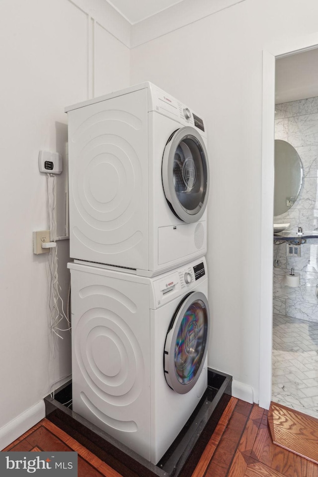 200 Locust St Unit 24Bn, Philadelphia, PA 19106 - laundry area with baseboards, stacked washer / drying machine, and laundry area