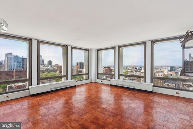 200 Locust St Unit 24Bn, Philadelphia, PA 19106 - unfurnished sunroom with visible vents, a city view, and a healthy amount of sunlight