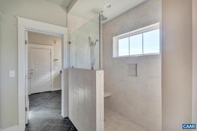 full bathroom featuring tile patterned floors and walk in shower