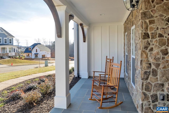 view of patio / terrace featuring a residential view and a porch