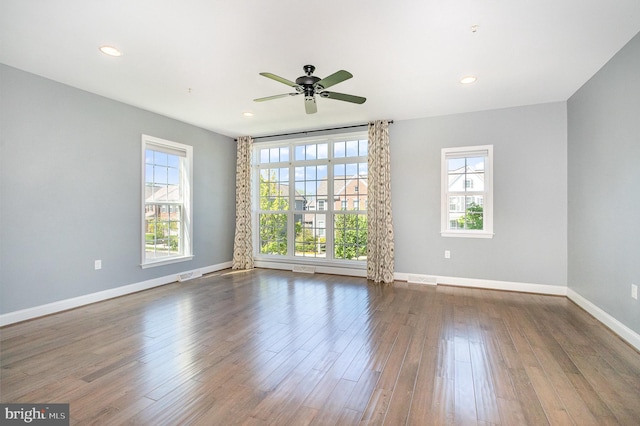 unfurnished room featuring visible vents, wood finished floors, baseboards, ceiling fan, and recessed lighting