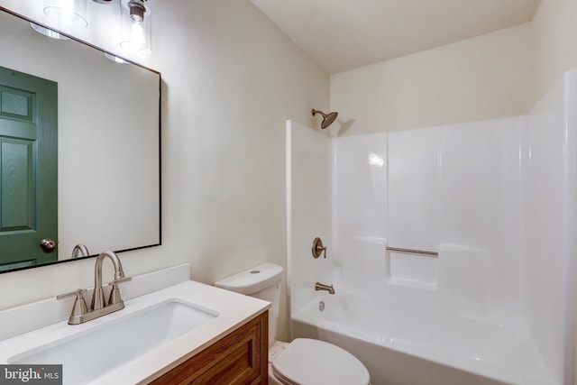 bathroom featuring vanity, shower / bathtub combination, and toilet