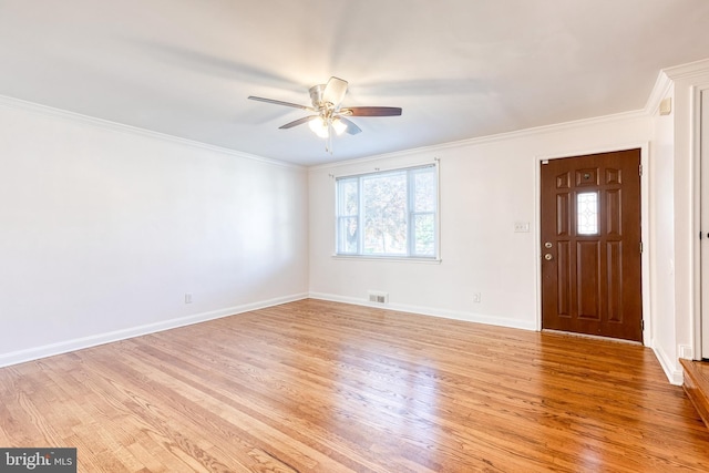 interior space with light wood-style floors, a ceiling fan, a wealth of natural light, and visible vents
