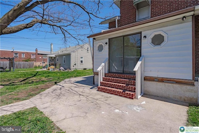 exterior space featuring fence and entry steps