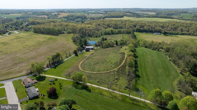 birds eye view of property featuring a rural view
