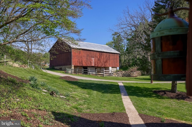 view of barn featuring a lawn