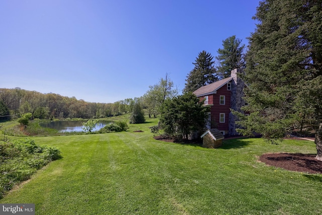 view of yard with a water view