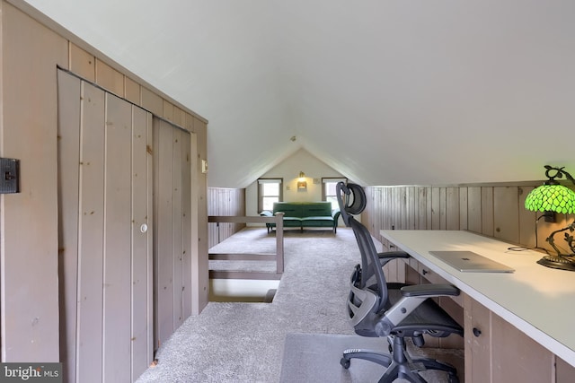 home office featuring lofted ceiling and carpet floors