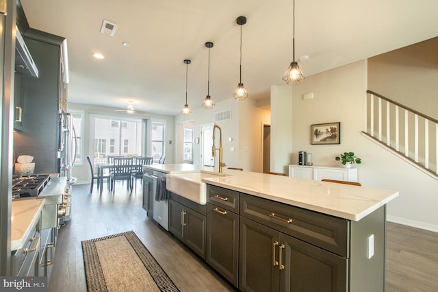 362 Star Tavern Ln, West Chester, PA 19382 - kitchen featuring visible vents, a center island with sink, a sink, and dark wood-type flooring