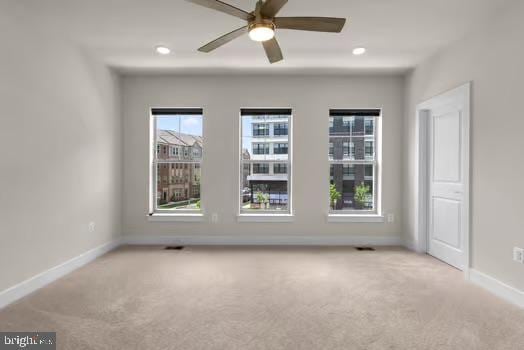 136 Salinger Dr Unit 136, Gaithersburg, MD 20878 - spare room with carpet floors, baseboards, and a ceiling fan