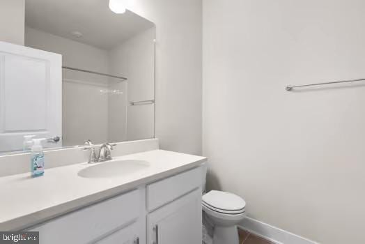 136 Salinger Dr Unit 136, Gaithersburg, MD 20878 - full bathroom with vanity, toilet, baseboards, and a shower