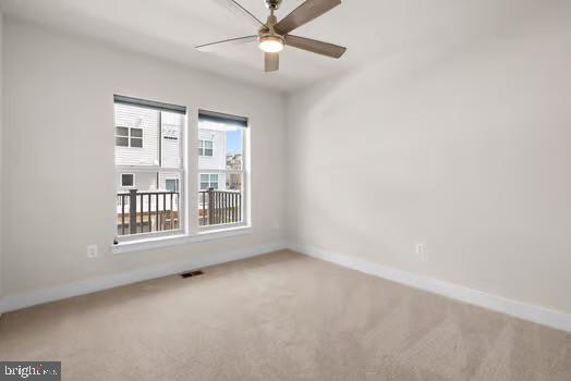 136 Salinger Dr Unit 136, Gaithersburg, MD 20878 - spare room with carpet flooring, baseboards, and a ceiling fan