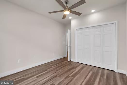136 Salinger Dr Unit 136, Gaithersburg, MD 20878 - unfurnished bedroom with wood finished floors, baseboards, recessed lighting, a closet, and ceiling fan