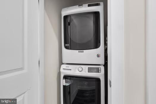 136 Salinger Dr Unit 136, Gaithersburg, MD 20878 - laundry room featuring stacked washer / drying machine and beverage cooler