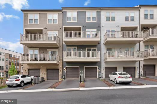 136 Salinger Dr Unit 136, Gaithersburg, MD 20878 - view of front facade with a garage and driveway
