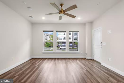 136 Salinger Dr Unit 136, Gaithersburg, MD 20878 - unfurnished room with wood finished floors, baseboards, a ceiling fan, and recessed lighting