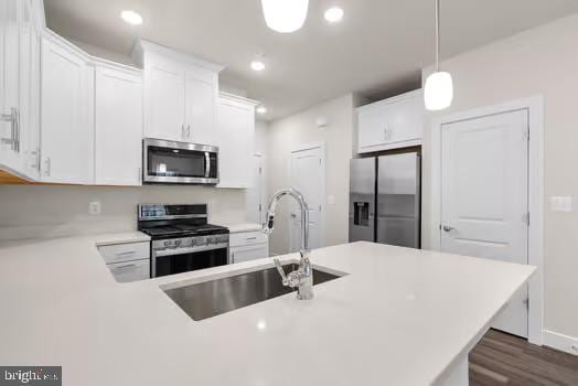 136 Salinger Dr Unit 136, Gaithersburg, MD 20878 - kitchen featuring appliances with stainless steel finishes, a sink, white cabinetry, light countertops, and dark wood finished floors
