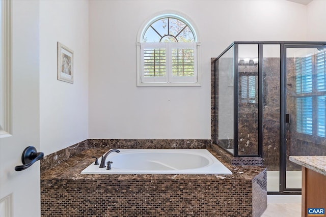 full bath featuring a shower stall and a bath