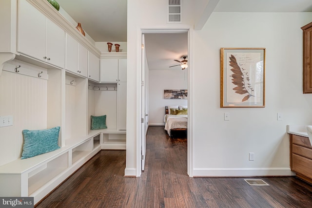 mudroom featuring dark wood-style flooring, ceiling fan, and baseboards