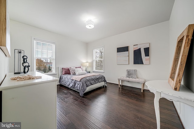 bedroom featuring dark wood-style flooring