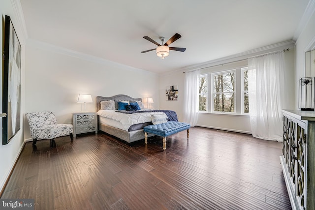 bedroom with crown molding, wood finished floors, baseboards, and ceiling fan