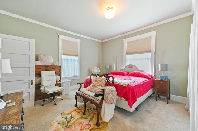 bedroom featuring carpet floors, baseboards, crown molding, and multiple windows