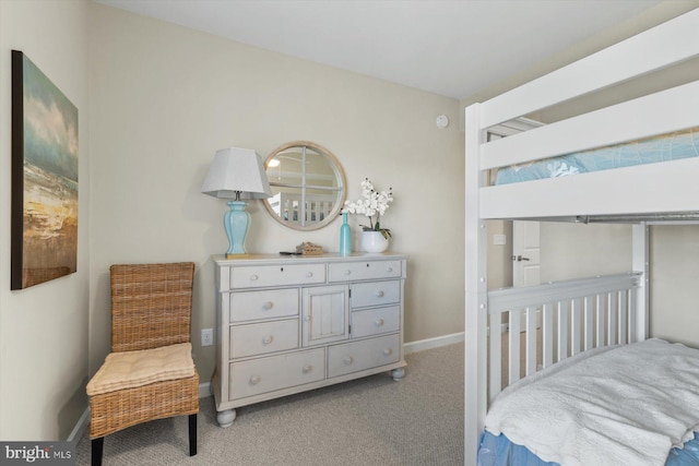 bedroom featuring carpet floors and baseboards