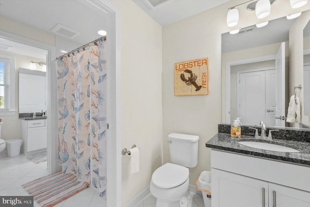 full bathroom featuring visible vents, tile patterned floors, toilet, and vanity